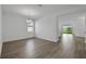 Dining room with wood floors, bright light fixture and white walls at 2860 Supermarine Rd, Tavares, FL 32778