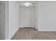 Bright entryway with wood look floors and a modern lighting fixture at 2860 Supermarine Rd, Tavares, FL 32778