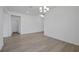 Bright living room with wood floors, recessed lighting, and white walls at 2860 Supermarine Rd, Tavares, FL 32778