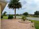 Paver driveway and well-manicured landscaping create an inviting curb appeal at 2918 Canyon Ave, The Villages, FL 32163