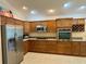 Spacious kitchen with ample cabinetry, stainless appliances, and granite countertops at 2918 Canyon Ave, The Villages, FL 32163