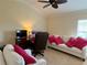 Comfortable living room with plush seating and a ceiling fan for a relaxing atmosphere at 2918 Canyon Ave, The Villages, FL 32163