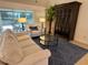 Open living room featuring a comfortable sofa, accent chair, and stylish decor at 2918 Canyon Ave, The Villages, FL 32163