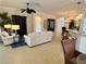 Spacious living room open to dining area, with modern decor and ample natural light at 2918 Canyon Ave, The Villages, FL 32163