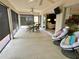 Spacious screened patio with comfortable seating and a view of the outdoors at 2918 Canyon Ave, The Villages, FL 32163