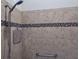Shower includes a built-in seat and grab bar and features earth-toned tile with a decorative tile border at 2918 Canyon Ave, The Villages, FL 32163