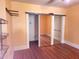 Bedroom with closet and shelving, neutral wall paint, and wood floors at 308 Sunnyside Dr, Leesburg, FL 34748