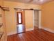 Bedroom with closet, wood floors, neutral wall paint, and view to another room at 308 Sunnyside Dr, Leesburg, FL 34748