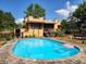 Swimming pool, yard and exterior of home showing stucco finish at 308 Sunnyside Dr, Leesburg, FL 34748