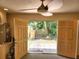 Open utility room with double doors leading to the outdoor deck area at 308 Sunnyside Dr, Leesburg, FL 34748