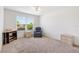 Well-lit bedroom features neutral carpet, a ceiling fan, and furniture at 3118 Sweetgum St, The Villages, FL 32163