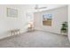 Bright, carpeted bedroom with side tables and plenty of natural light at 3118 Sweetgum St, The Villages, FL 32163
