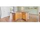Spacious kitchen island with a wooden base and stylish countertop, perfect for entertaining at 3118 Sweetgum St, The Villages, FL 32163