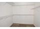 Walk-in closet with wire shelving and wood-look flooring at 3177 Williams Rd, The Villages, FL 32162