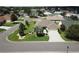 Well-maintained single-story home with a manicured lawn, elegant landscaping, and a paved driveway at 3177 Williams Rd, The Villages, FL 32162