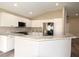 Well-equipped kitchen with stainless steel appliances, granite countertops, and white cabinets at 3177 Williams Rd, The Villages, FL 32162