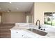 Open kitchen layout with stainless steel sink and granite countertops at 3177 Williams Rd, The Villages, FL 32162