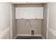 Laundry room with white cabinets and washer/dryer hookups at 3177 Williams Rd, The Villages, FL 32162