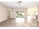 Bright and airy living room with vinyl floors and slider doors at 3177 Williams Rd, The Villages, FL 32162
