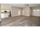 Open concept living area connecting the kitchen with the living room and dining areas at 3177 Williams Rd, The Villages, FL 32162