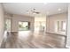 Spacious living room showcases modern design with natural light and vinyl floors at 3177 Williams Rd, The Villages, FL 32162