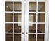 Office/Den featuring glass paneled doors and luxury vinyl plank flooring at 3177 Williams Rd, The Villages, FL 32162