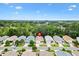 Aerial view of a charming community with tree-lined streets and well-maintained homes at 3472 Roanoke St, The Villages, FL 32162