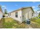 Well-maintained backyard featuring a patio area and lush green lawn, perfect for outdoor activities at 3472 Roanoke St, The Villages, FL 32162