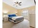 Bright primary bedroom with a ceiling fan and plenty of natural light at 3472 Roanoke St, The Villages, FL 32162