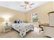 Sunny bedroom complete with ceiling fan, desk and chair at 3472 Roanoke St, The Villages, FL 32162