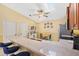 Bright kitchen with a breakfast bar, skylight, modern appliances, and a cozy dining nook at 3472 Roanoke St, The Villages, FL 32162