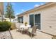 Cozy patio with seating, perfect for enjoying outdoor dining and relaxation on a sunny day at 3472 Roanoke St, The Villages, FL 32162