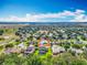 An aerial view showcasing the property's location within a residential neighborhood and lush green surroundings at 3731 Peaceful Valley Dr, Clermont, FL 34711
