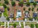 An aerial view of a neighborhood featuring single Gathering homes, pools, and lush landscaping at 3731 Peaceful Valley Dr, Clermont, FL 34711