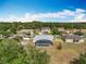 Aerial view featuring the private pool, well-maintained landscaping, and peaceful neighborhood at 3731 Peaceful Valley Dr, Clermont, FL 34711