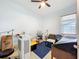 Bedroom with a ceiling fan, window, tile floors and lots of furniture for moving in at 3731 Peaceful Valley Dr, Clermont, FL 34711