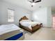 Bedroom features a queen bed, a toddler bed, tile flooring and two windows for light at 3731 Peaceful Valley Dr, Clermont, FL 34711