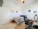 Bedroom with a ceiling fan, a window for natural light, bed and an office chair at 3731 Peaceful Valley Dr, Clermont, FL 34711