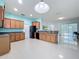 A spacious kitchen with wood cabinets, stainless steel appliances and an eat-in space at 3731 Peaceful Valley Dr, Clermont, FL 34711