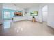 The open floor plan of the living room blends with the kitchen for modern living at 3731 Peaceful Valley Dr, Clermont, FL 34711