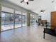 Spacious sunroom boasts lots of windows with a dining area and views of the pool at 3731 Peaceful Valley Dr, Clermont, FL 34711