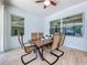 Inviting sunroom featuring a ceiling fan and lots of natural light, great for enjoying meals and relaxing at 3731 Peaceful Valley Dr, Clermont, FL 34711