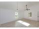 Bright living space with white walls, hard surface floors, and natural light from large windows at 4817 Cr 686, Webster, FL 33597