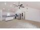Open-concept living space with modern lighting, kitchen view and neutral decor at 4817 Cr 686, Webster, FL 33597