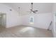 Spacious living room featuring light colored floors, a window and a modern ceiling fan at 4817 Cr 686, Webster, FL 33597