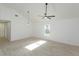Open living space with white walls, hard surface floors, and a modern ceiling fan at 4817 Cr 686, Webster, FL 33597