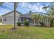 Private screened-in pool with a view of the landscaped backyard and pond beyond at 4879 Brightmour Cir, Orlando, FL 32837