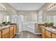 Bathroom with double vanity, glass shower, soaking tub, and tile flooring at 4879 Brightmour Cir, Orlando, FL 32837