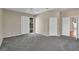 Spacious bedroom with plush carpeting, ceiling fan, pool views and easy access to adjacent rooms at 4879 Brightmour Cir, Orlando, FL 32837