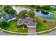 Waterfront home surrounded by lush lawns and landscaping and located on a cul-de-sac on a pristine lake at 4879 Brightmour Cir, Orlando, FL 32837
